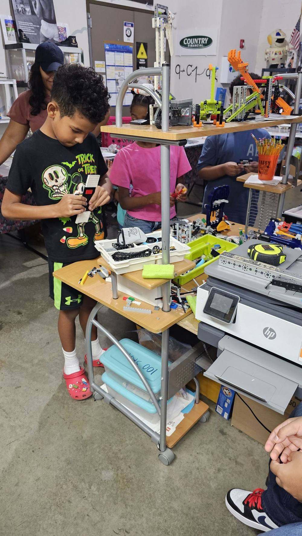 Scholars building robots in the C.I.R.C.U.I.T. Robotics program at Young Laureates